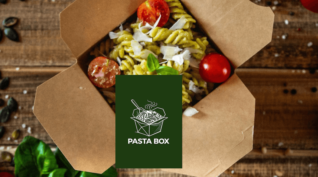 Open cardboard takeout box filled with fusilli pasta, tomatoes, and basil; dark green label reads PASTA BOX.